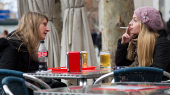 Girls smoking at Cafe in Madrid Spain