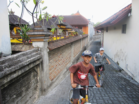Boys biking Bali Indonesia