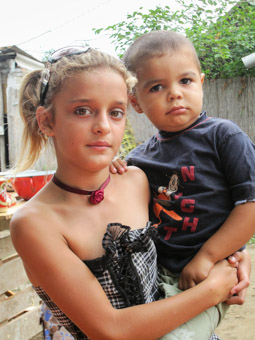 Roma Girl with toddler brother Serbian border Hungary