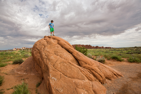 boy standing on large rock Zion National Park Utah