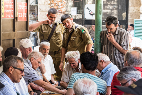 men playing backgammon in jerusalem market