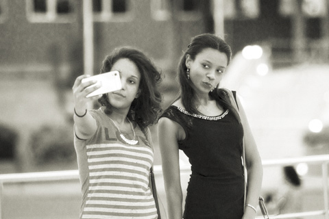 Two girls taking a selfy in Santiago Dominican Republic