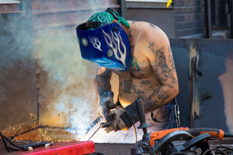 welder welding on the street in Jersey City, New Jersey
